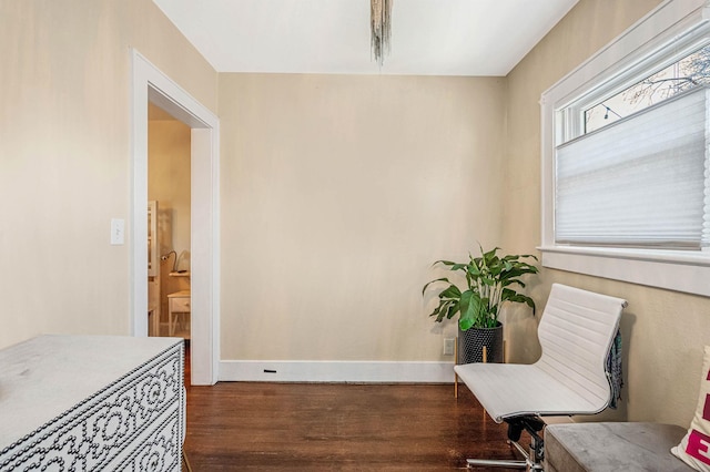 living area with hardwood / wood-style floors