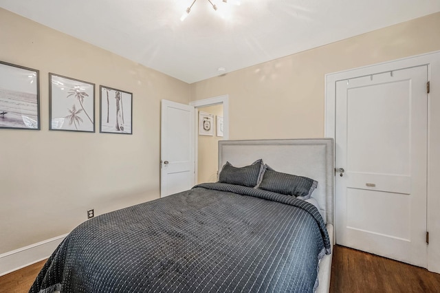 bedroom featuring dark hardwood / wood-style flooring