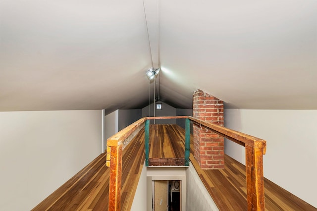 stairs featuring vaulted ceiling