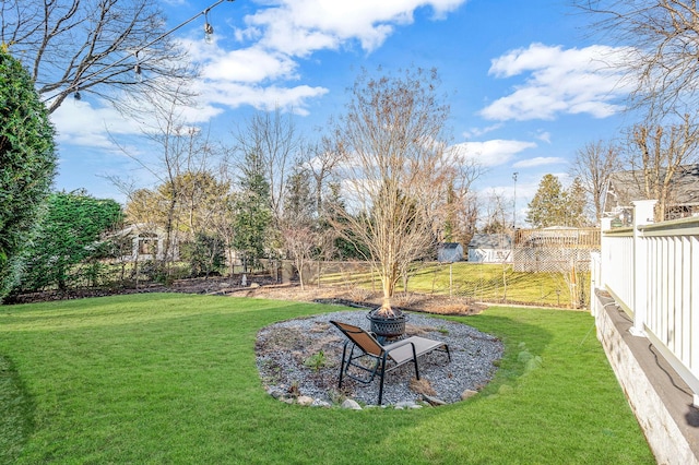 view of yard featuring an outdoor fire pit