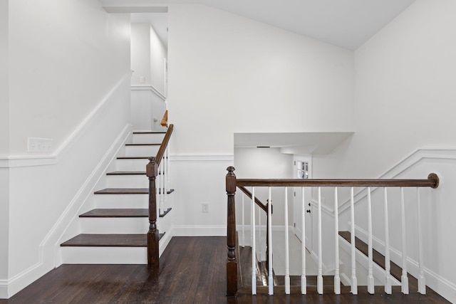 staircase with wood-type flooring