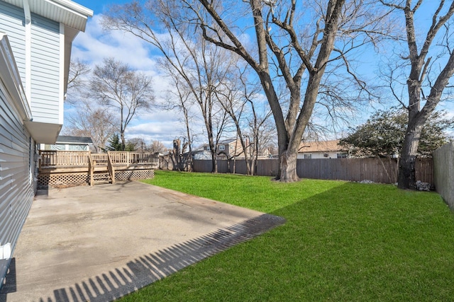 view of yard featuring a patio and a deck