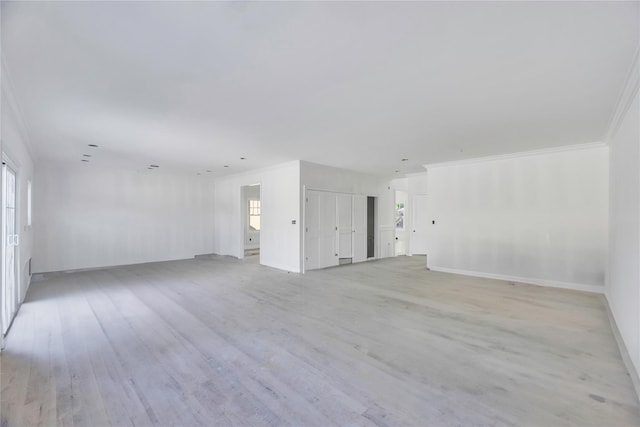 unfurnished room with light hardwood / wood-style floors and ornamental molding