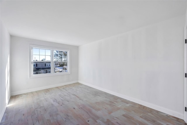 unfurnished room featuring light hardwood / wood-style floors