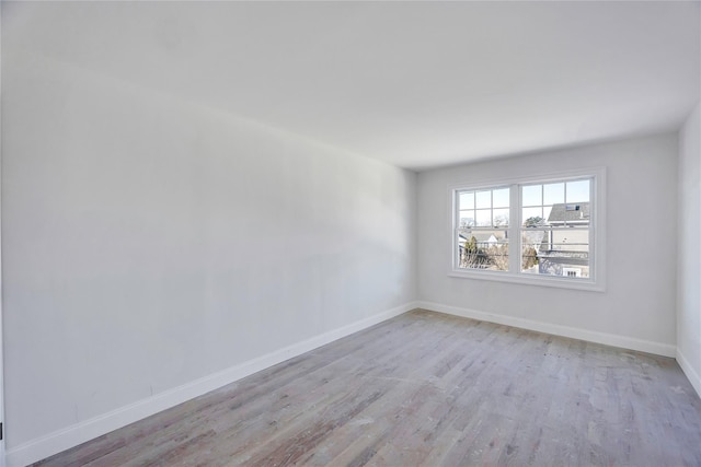 spare room with light wood-type flooring