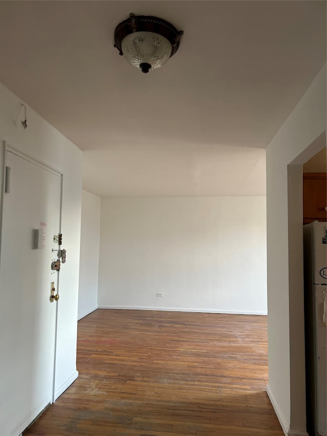 hallway with dark wood-type flooring