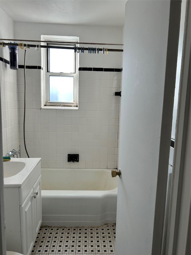 bathroom featuring tile patterned flooring and vanity