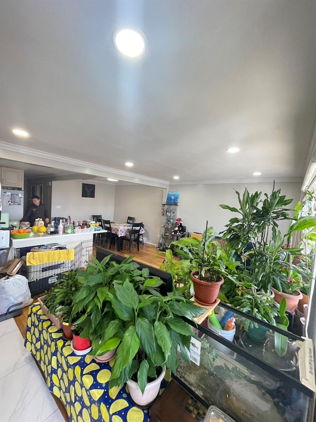 interior space with crown molding