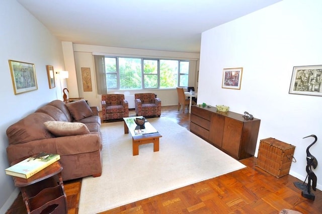 living room featuring parquet floors