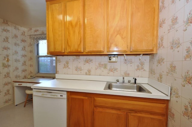 kitchen with white dishwasher, sink, and decorative backsplash