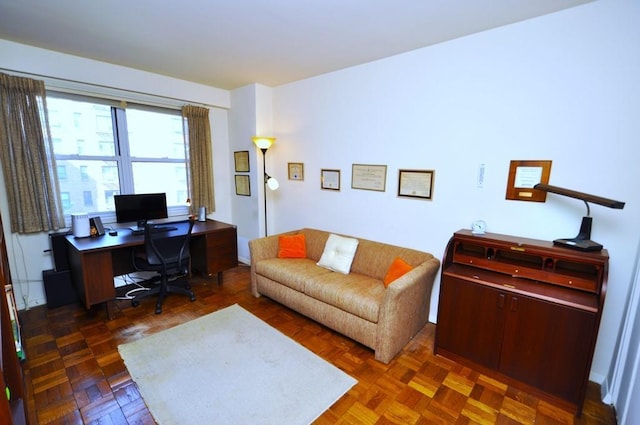 office area with dark parquet flooring