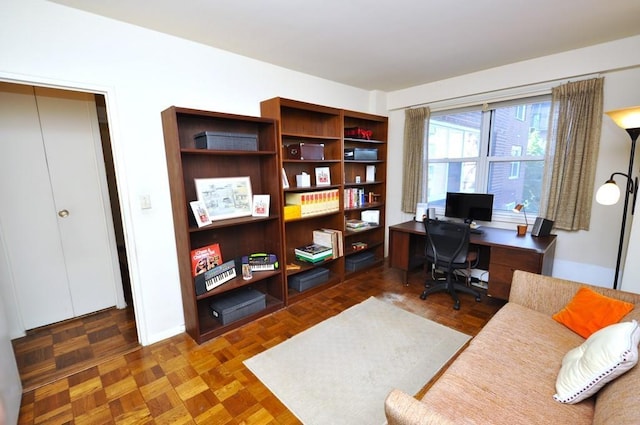 home office featuring dark parquet flooring