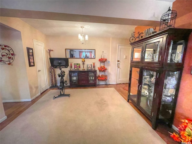 interior space with hardwood / wood-style flooring and a chandelier