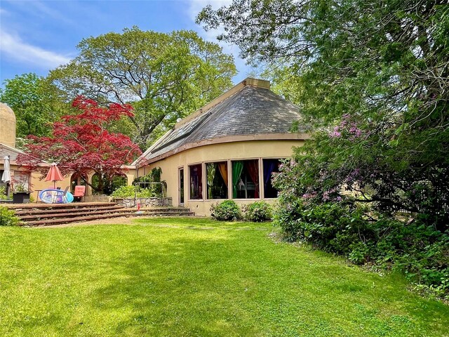 6 Hidden Pond, Muttontown, NY 11545 - back of house featuring a yard and stucco siding
