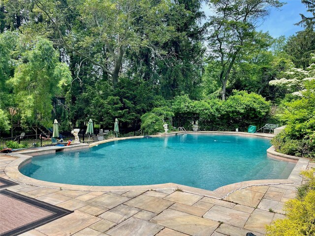 6 Hidden Pond, Muttontown, NY 11545 - swimming pool with a patio area