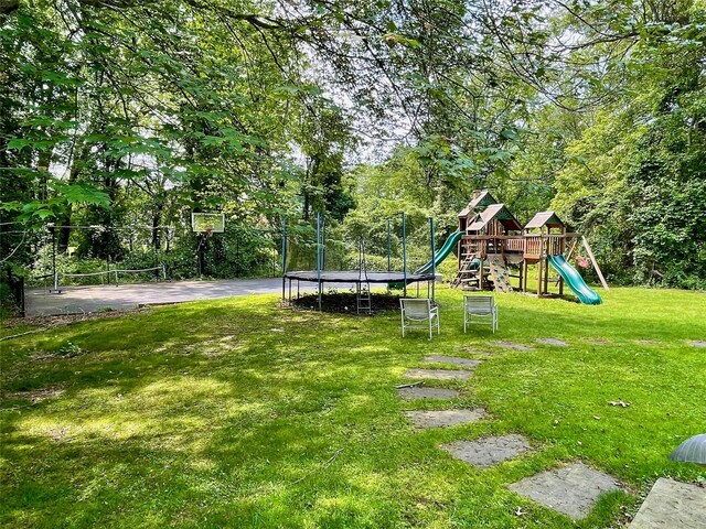 6 Hidden Pond, Muttontown, NY 11545 - view of green lawn with a trampoline and a playground