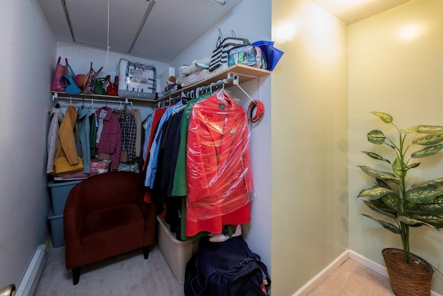 spacious closet with carpet and baseboard heating