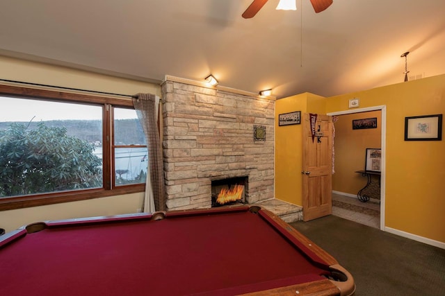 recreation room featuring carpet flooring, ceiling fan, a stone fireplace, and billiards