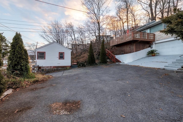 property exterior at dusk with a garage