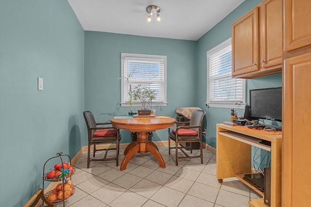 dining area with light tile patterned flooring