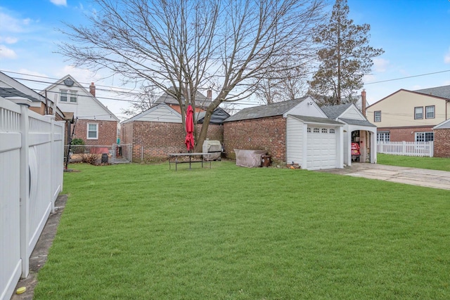 view of yard with a garage and an outdoor structure