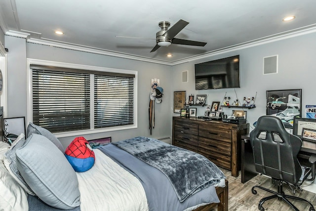 bedroom with ceiling fan, crown molding, and light hardwood / wood-style flooring