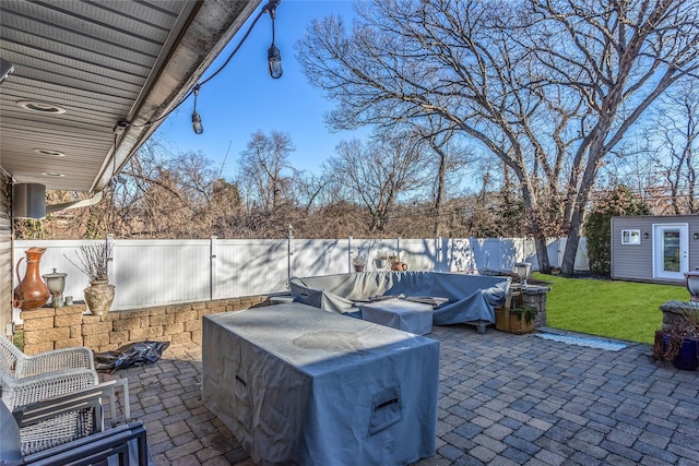 view of patio featuring an outbuilding