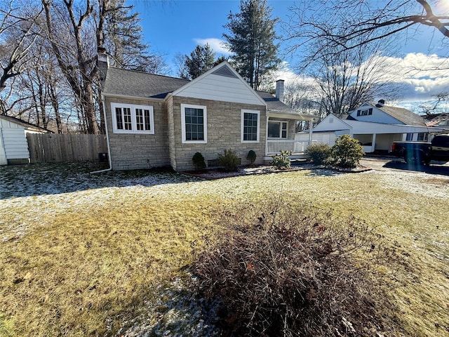 view of front facade with covered porch and a front yard