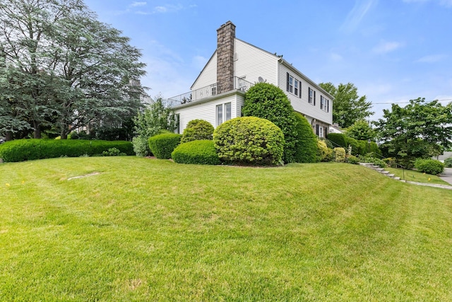 view of home's exterior with a lawn