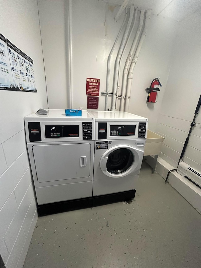 laundry area with separate washer and dryer