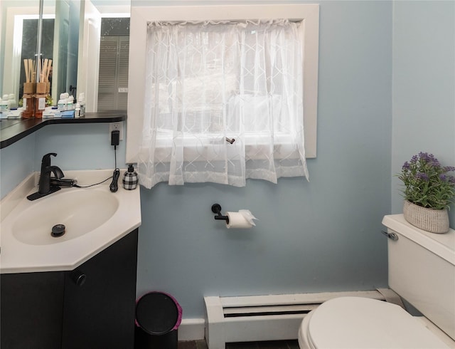 bathroom with toilet and vanity