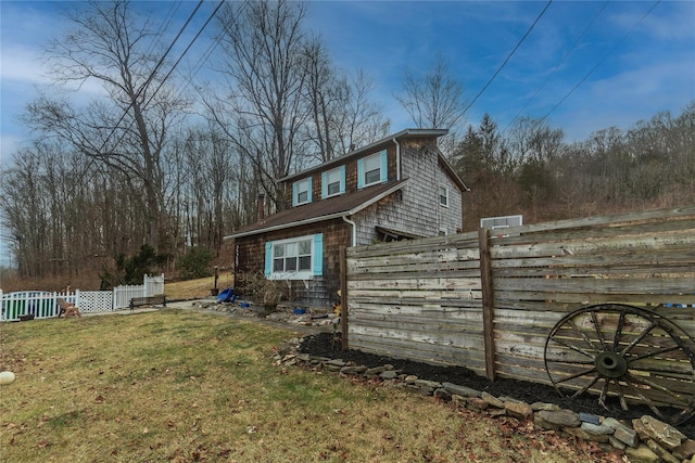 view of home's exterior featuring a lawn