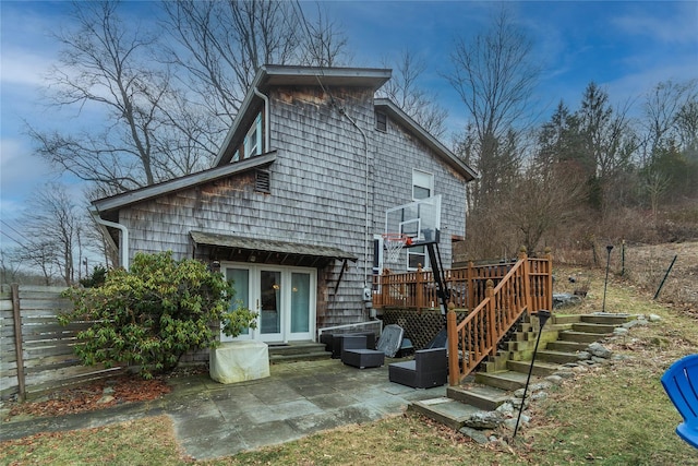 back of house with a patio