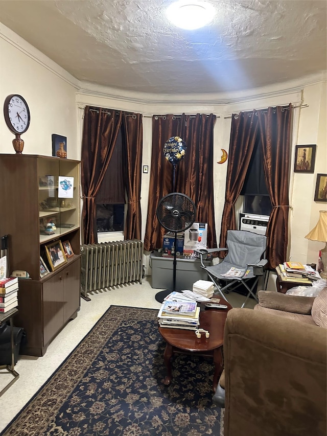 living area featuring cooling unit, carpet flooring, crown molding, and a textured ceiling