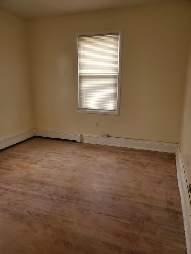 unfurnished room featuring light hardwood / wood-style floors