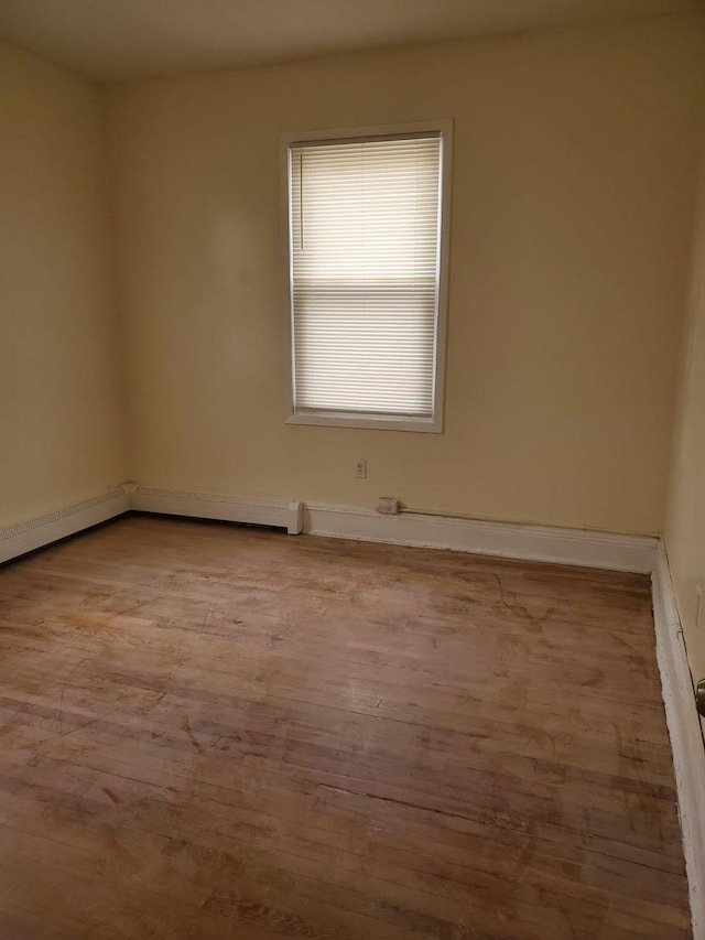 spare room featuring light wood-type flooring