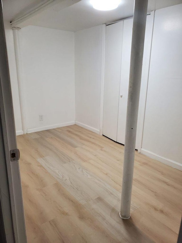 spare room featuring light hardwood / wood-style floors