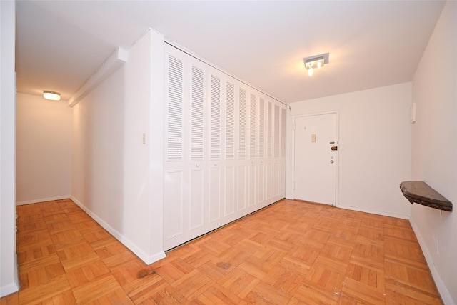 corridor with light parquet floors