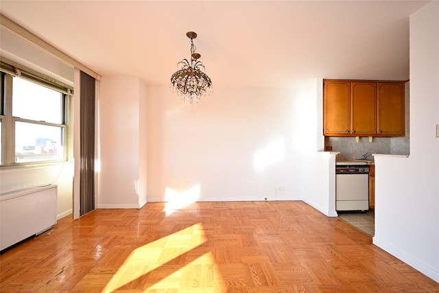 unfurnished dining area featuring radiator heating unit, light parquet flooring, and a notable chandelier