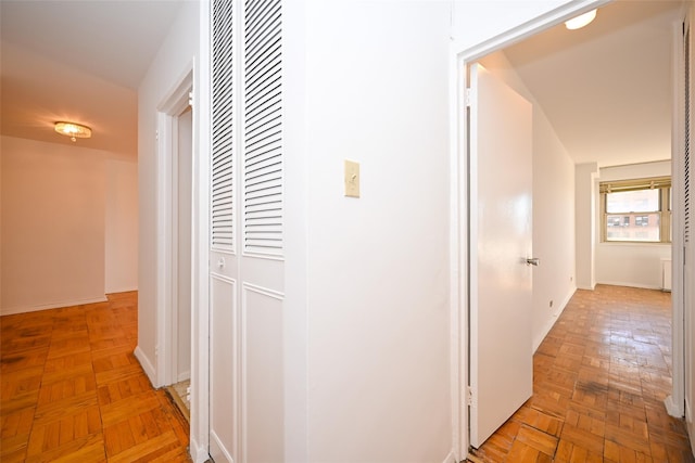 hallway with light parquet floors