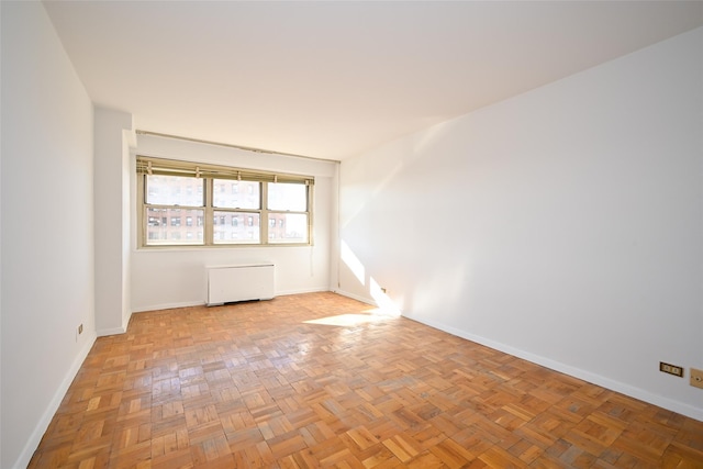 empty room with light parquet floors