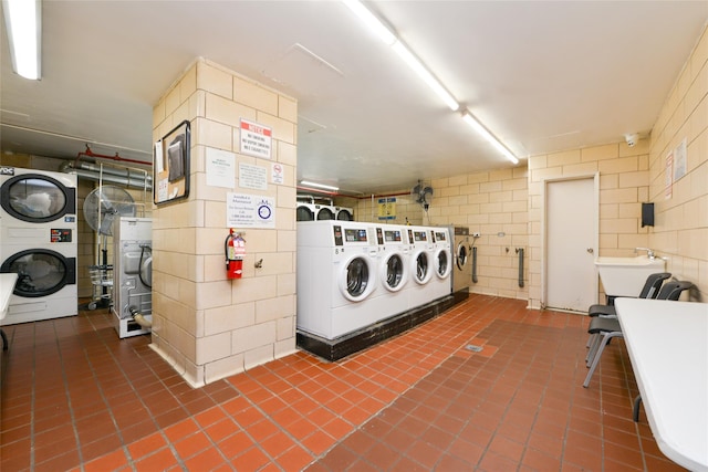 laundry room featuring washer and dryer, sink, and stacked washer and dryer