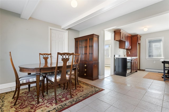 dining room with beamed ceiling, baseboard heating, and plenty of natural light