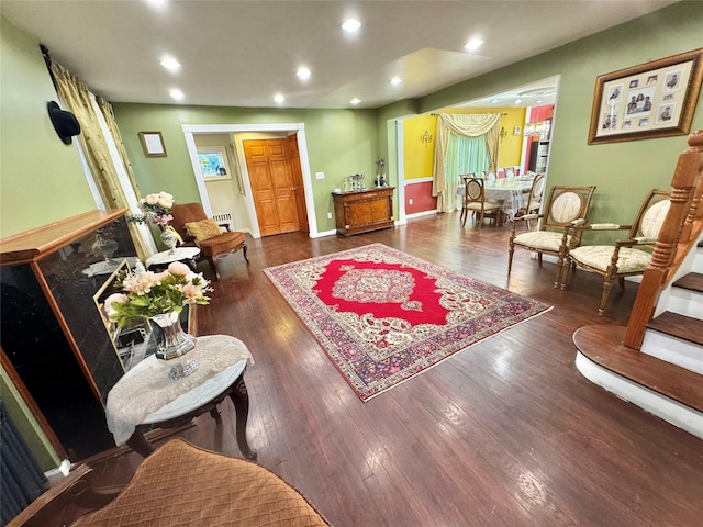 sitting room with dark wood-type flooring