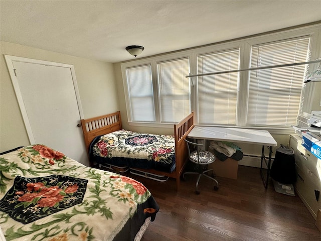 bedroom featuring dark hardwood / wood-style flooring and a baseboard radiator