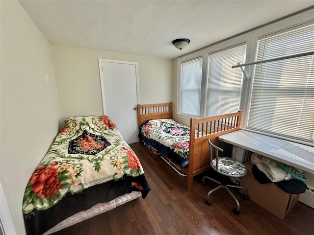 bedroom featuring dark wood-type flooring