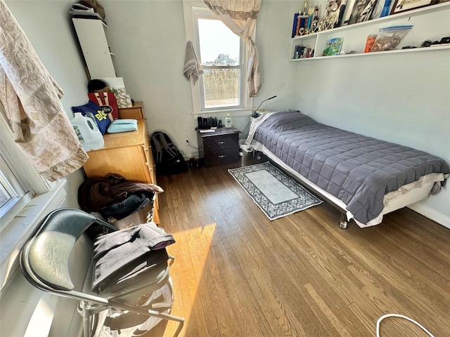 bedroom featuring hardwood / wood-style flooring