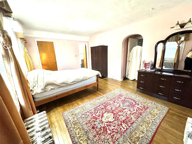 bedroom with hardwood / wood-style flooring