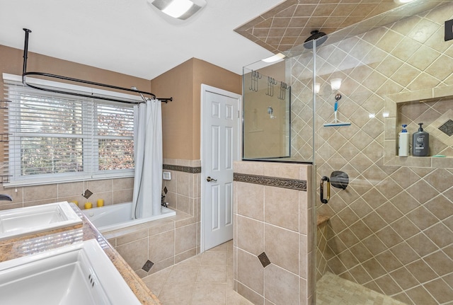 bathroom with separate shower and tub, tile patterned floors, and vanity