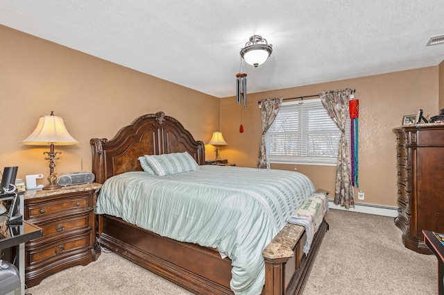 carpeted bedroom featuring a baseboard heating unit